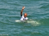 Kelly Slater salutes the fans on the Huntington Beach Pier