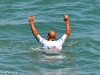 Kelly Slater raises hands as he is announced winner.